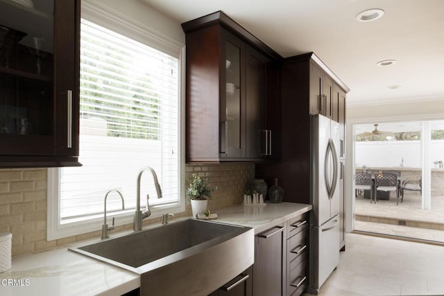 1325 Rexford Ave, Pasadena, CA 91107 - kitchen featuring a sink, healthy amount of natural light, decorative backsplash, glass insert cabinets, and recessed lighting