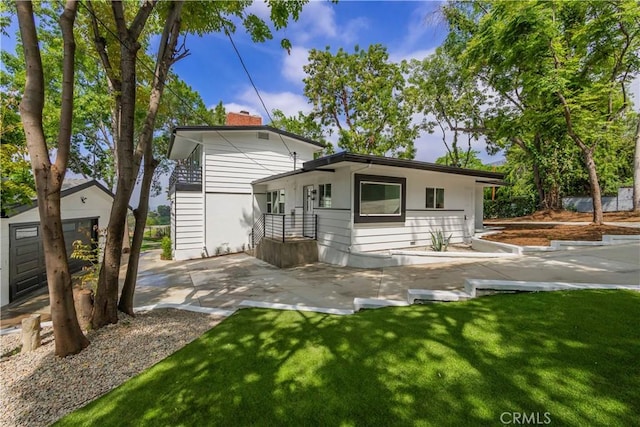 700 Norumbega Dr, Monrovia, CA 91016 - back of house featuring a chimney, a yard, and a patio area