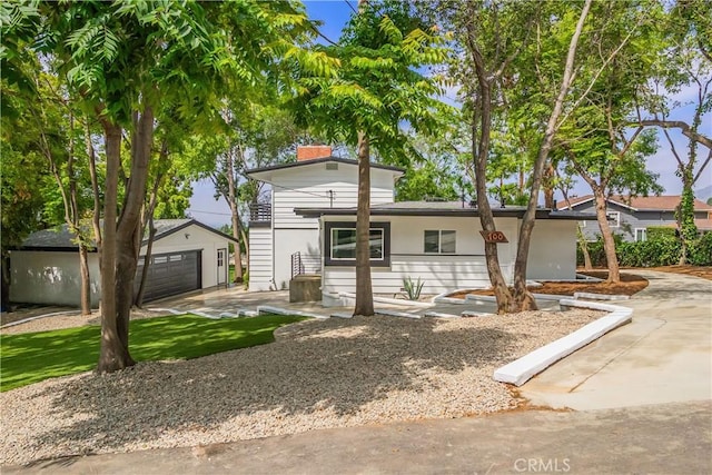 700 Norumbega Dr, Monrovia, CA 91016 - view of front of home featuring an outbuilding, a detached garage, and a chimney
