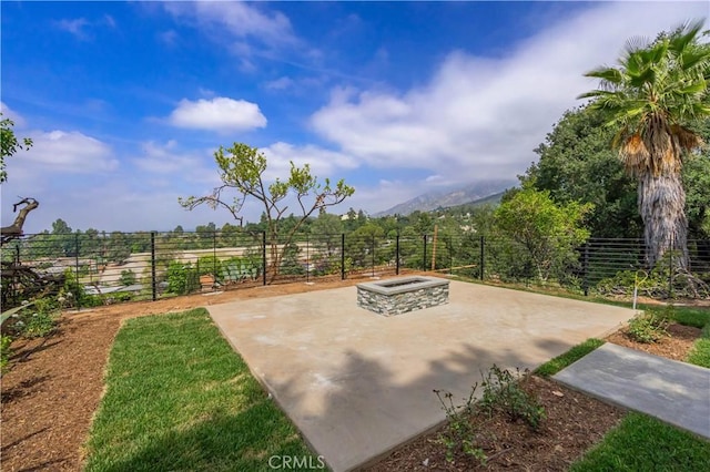 700 Norumbega Dr, Monrovia, CA 91016 - view of patio with a mountain view and an outdoor fire pit