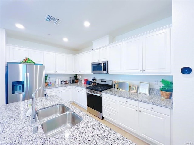 3410 E Foxglove Way, Ontario, CA 91761 - kitchen with appliances with stainless steel finishes, a sink, white cabinetry, and recessed lighting