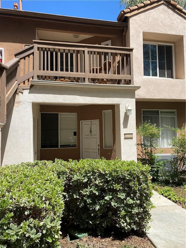 28107 Caldaro, Laguna Niguel, CA 92677 - view of exterior entry with a balcony and stucco siding