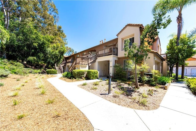 28107 Caldaro, Laguna Niguel, CA 92677 - view of front of house featuring stairs, stucco siding, and a balcony