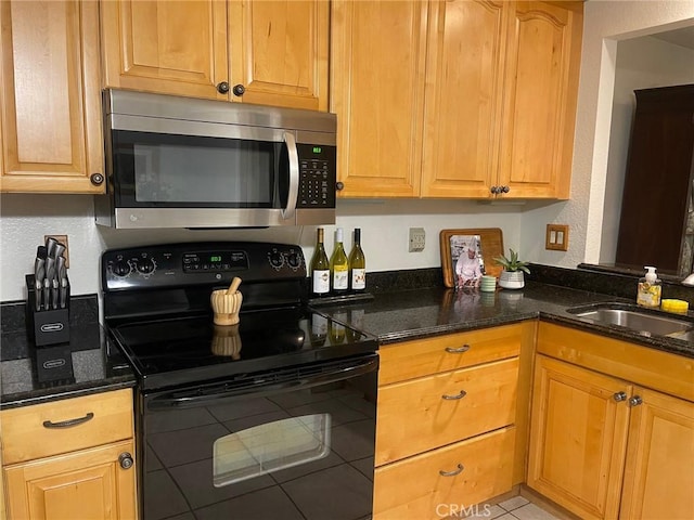 24603 Copper Cliff Ct Unit 11, Lake Forest, CA 92630 - kitchen featuring stainless steel microwave, black electric range oven, a sink, dark stone counters, and a textured wall