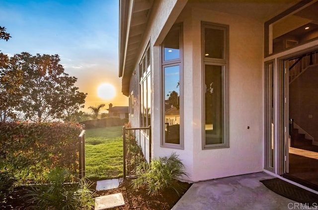 1808 Amalfi Dr, Encinitas, CA 92024 - doorway to property featuring stucco siding and a lawn