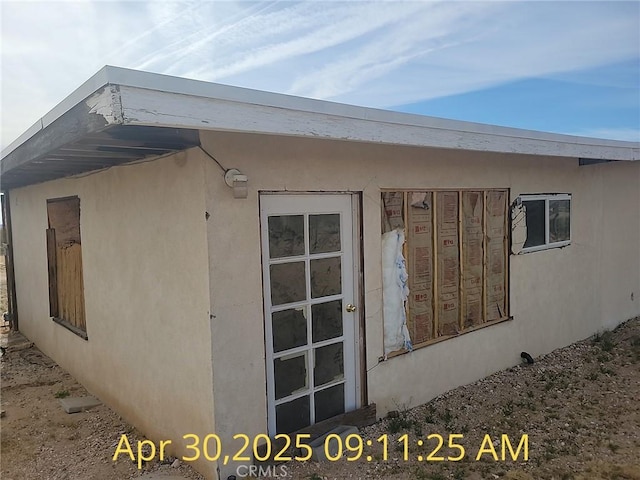 view of home's exterior with stucco siding