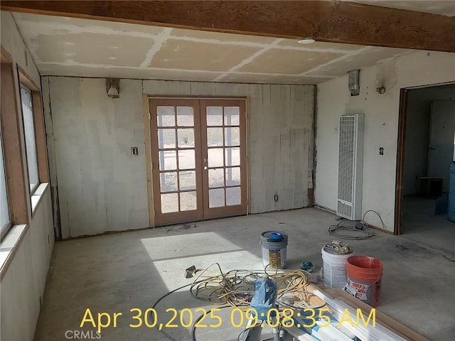 interior space featuring a heating unit and french doors