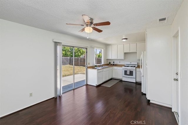 1443 E Bonnie Brae St, Ontario, CA 91764 - kitchen featuring white appliances, dark wood-style flooring, a ceiling fan, white cabinets, and a sink