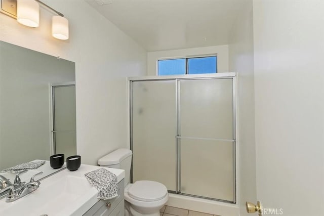 1443 E Bonnie Brae St, Ontario, CA 91764 - full bathroom featuring toilet, an enclosed shower, tile patterned flooring, and vanity