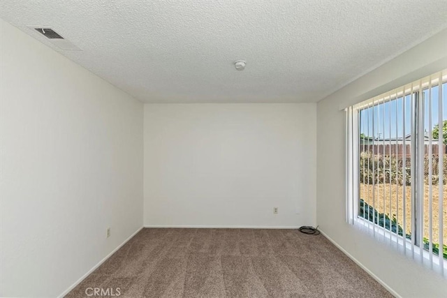1443 E Bonnie Brae St, Ontario, CA 91764 - spare room with carpet, a textured ceiling, a smoke detector, and baseboards