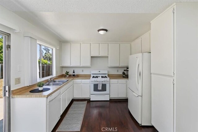 1443 E Bonnie Brae St, Ontario, CA 91764 - kitchen with white appliances, a sink, dark wood finished floors, light countertops, and a textured ceiling