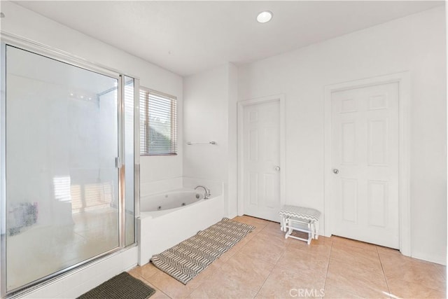 full bathroom with a shower stall, tile patterned flooring, and a whirlpool tub