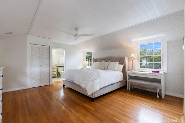 4225 Myrtle Ave, Long Beach, CA 90807 - bedroom featuring light wood finished floors, vaulted ceiling, baseboards, multiple windows, and wallpapered walls