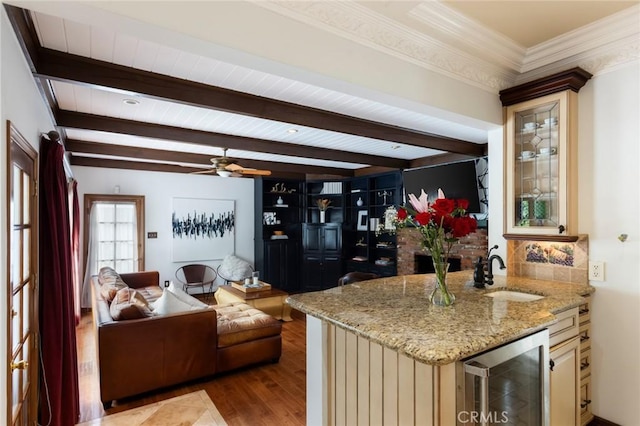 4225 Myrtle Ave, Long Beach, CA 90807 - kitchen with wine cooler, wood finished floors, a sink, cream cabinetry, and beam ceiling