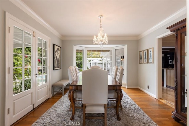 4225 Myrtle Ave, Long Beach, CA 90807 - dining room with french doors, a chandelier, wood finished floors, baseboards, and ornamental molding