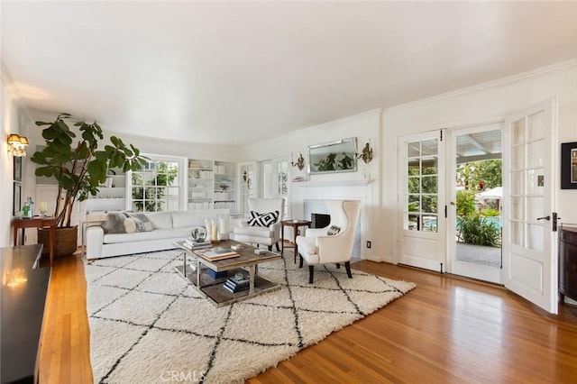 4225 Myrtle Ave, Long Beach, CA 90807 - living room with crown molding, wood finished floors, and a fireplace