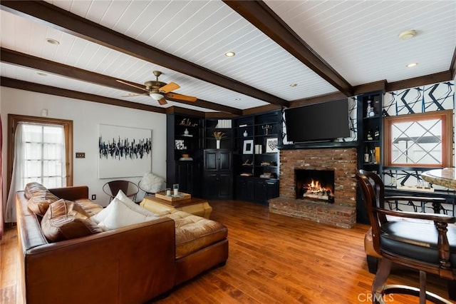 4225 Myrtle Ave, Long Beach, CA 90807 - living room with a fireplace, beam ceiling, wood finished floors, and a ceiling fan