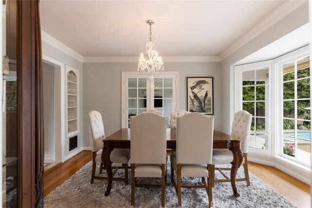 4225 Myrtle Ave, Long Beach, CA 90807 - dining room with wood finished floors, ornamental molding, a chandelier, and baseboards