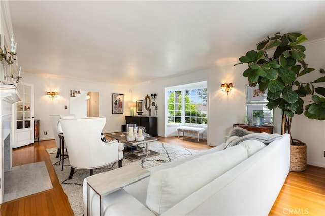 4225 Myrtle Ave, Long Beach, CA 90807 - living area with a high end fireplace, wood finished floors, and ornamental molding