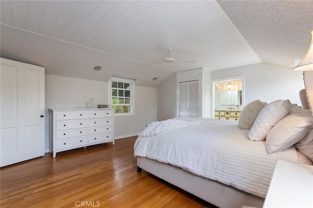 4225 Myrtle Ave, Long Beach, CA 90807 - bedroom with wood finished floors, vaulted ceiling, baseboards, ceiling fan, and ensuite bath