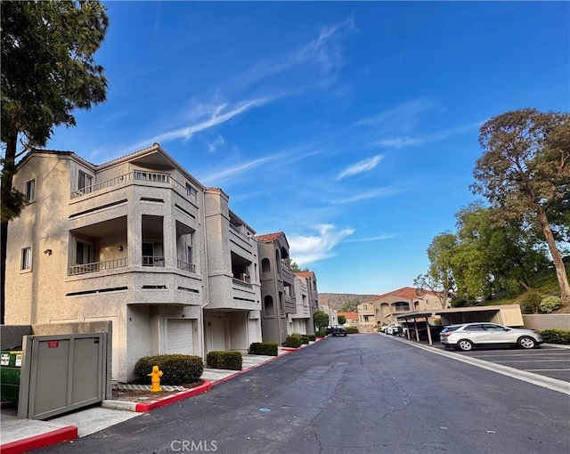 1980 Las Colinas Cir Unit 301, Corona, CA 92879 - view of asphalt road featuring a residential view