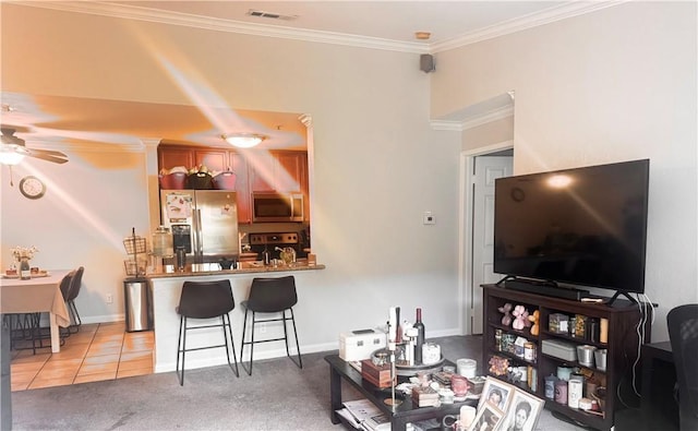 1980 Las Colinas Cir Unit 301, Corona, CA 92879 - living room featuring a ceiling fan, crown molding, light tile patterned floors, and baseboards