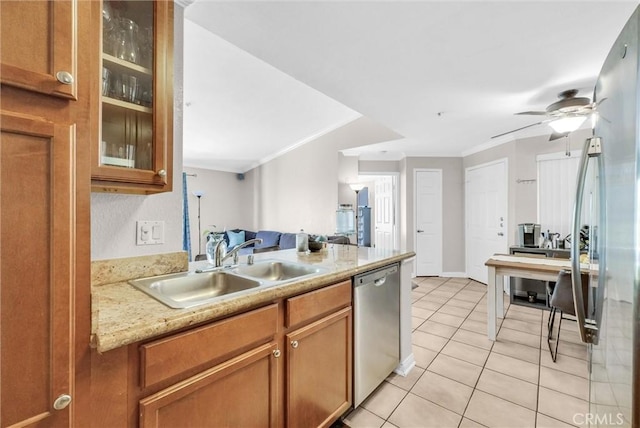1980 Las Colinas Cir Unit 301, Corona, CA 92879 - kitchen with stainless steel appliances, crown molding, light tile patterned flooring, light countertops, and glass insert cabinets