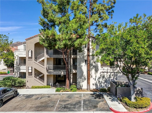 1980 Las Colinas Cir Unit 301, Corona, CA 92879 - view of property with stairs and uncovered parking