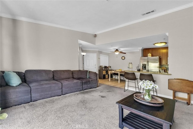 1980 Las Colinas Cir Unit 301, Corona, CA 92879 - living area with light carpet, crown molding, and ceiling fan