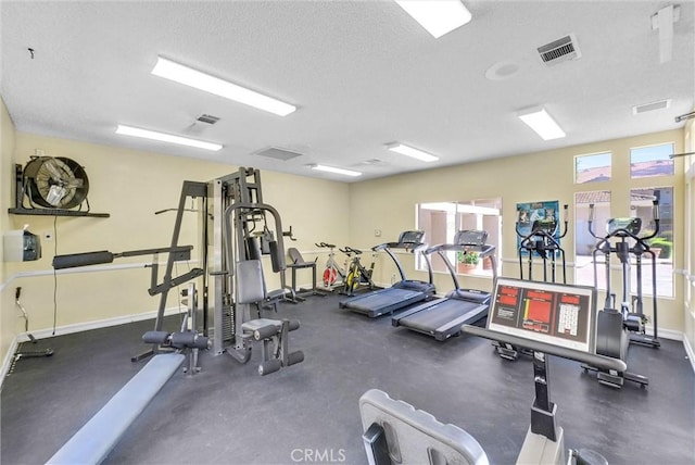 1980 Las Colinas Cir Unit 301, Corona, CA 92879 - gym featuring a textured ceiling and baseboards