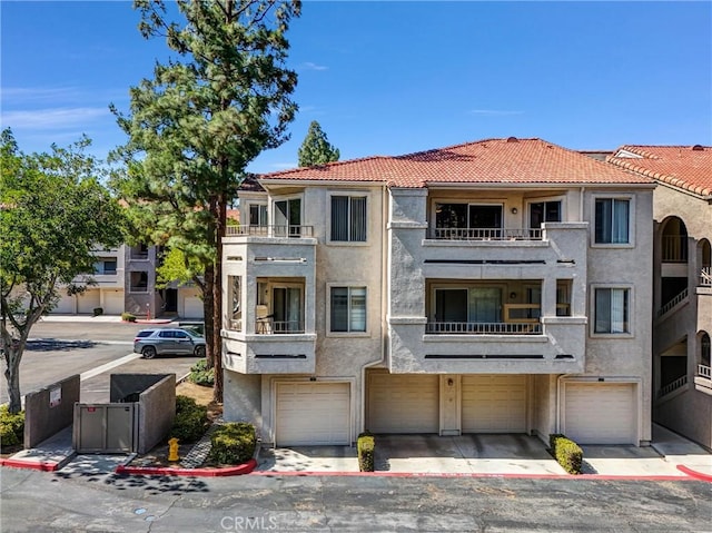 1980 Las Colinas Cir Unit 301, Corona, CA 92879 - view of building exterior with a garage and driveway