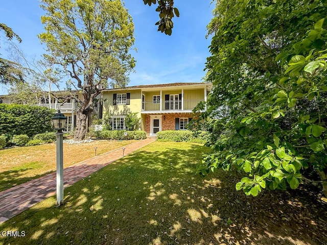 1908 Warwick Rd, San Marino, CA 91108 - view of front facade featuring a balcony, a front yard, and brick siding