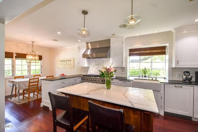 1908 Warwick Rd, San Marino, CA 91108 - kitchen featuring wall chimney exhaust hood, a sink, plenty of natural light, white cabinets, and recessed lighting