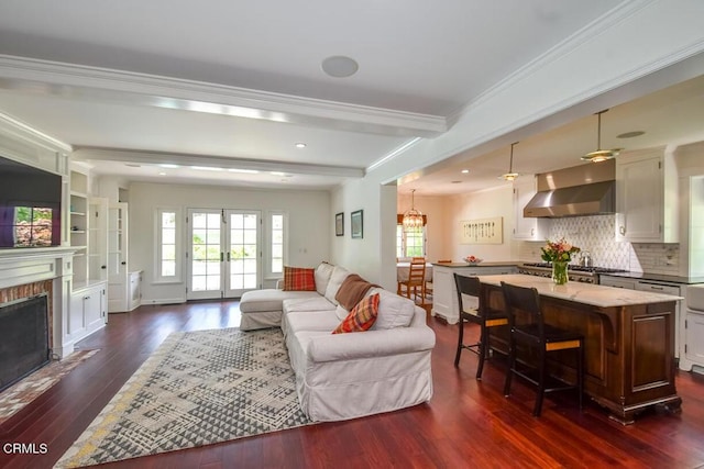 1908 Warwick Rd, San Marino, CA 91108 - living area with dark wood-type flooring, beamed ceiling, a fireplace with flush hearth, crown molding, and recessed lighting