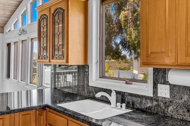 2117 Vista Entrada, Newport Beach, CA 92660 - kitchen featuring a sink, decorative backsplash, dark stone counters, and wood ceiling
