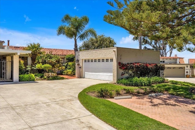 2117 Vista Entrada, Newport Beach, CA 92660 - view of front facade with a garage and stucco siding
