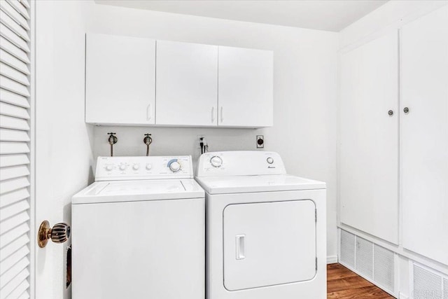 2117 Vista Entrada, Newport Beach, CA 92660 - washroom with cabinet space, washer and dryer, and wood finished floors