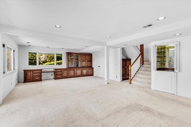 2117 Vista Entrada, Newport Beach, CA 92660 - unfurnished living room featuring stairs, light colored carpet, and recessed lighting