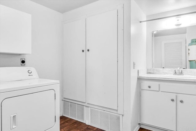 2117 Vista Entrada, Newport Beach, CA 92660 - laundry area with washer / dryer, cabinet space, and dark wood finished floors