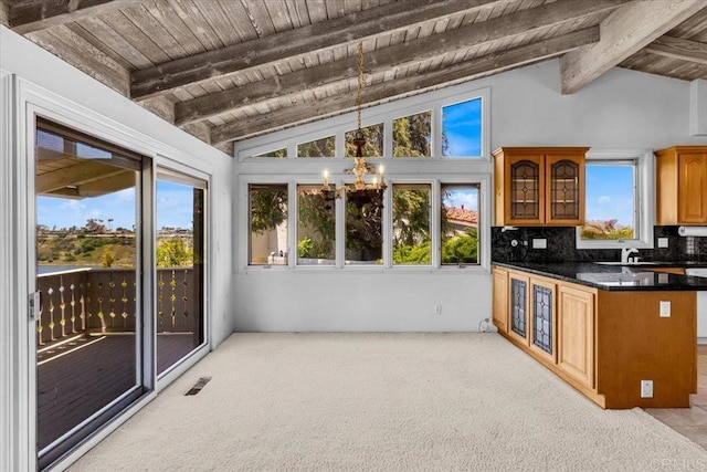 2117 Vista Entrada, Newport Beach, CA 92660 - kitchen with wood ceiling, a chandelier, dark countertops, tasteful backsplash, and glass insert cabinets