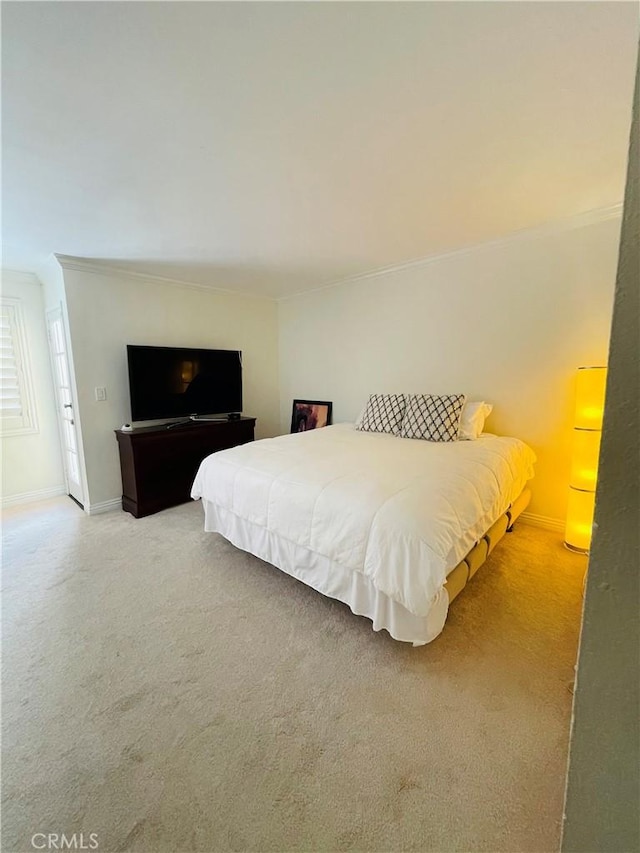 227 E Burbank Blvd Unit E, Burbank, CA 91502 - bedroom with light colored carpet, ornamental molding, and baseboards