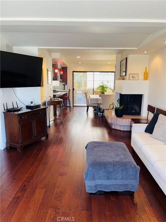 227 E Burbank Blvd Unit E, Burbank, CA 91502 - living area featuring wood-type flooring and a fireplace with raised hearth
