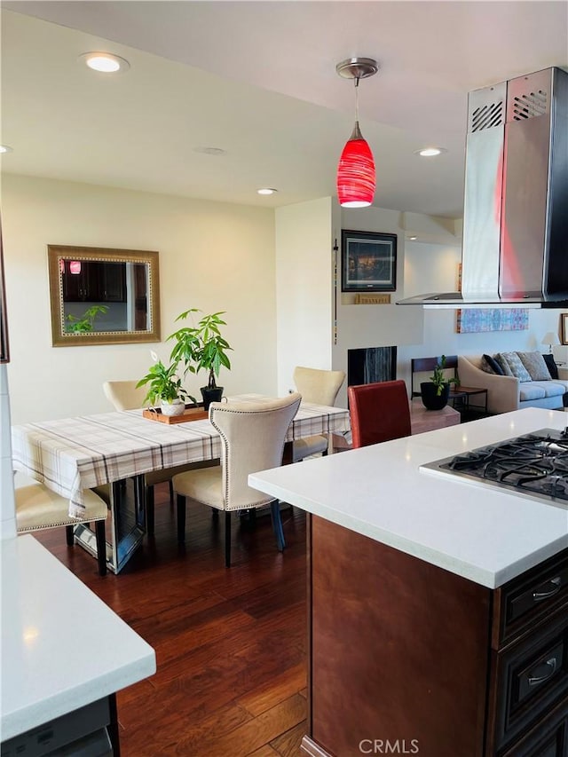 227 E Burbank Blvd Unit E, Burbank, CA 91502 - kitchen featuring light countertops, dark wood-type flooring, decorative light fixtures, island range hood, and recessed lighting