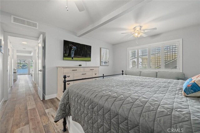22244 Treasure Island Dr Unit 5, Canyon Lake, CA 92587 - bedroom featuring wood finished floors, baseboards, beam ceiling, and ceiling fan