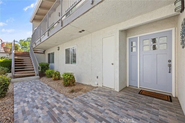 22244 Treasure Island Dr Unit 5, Canyon Lake, CA 92587 - property entrance with stucco siding
