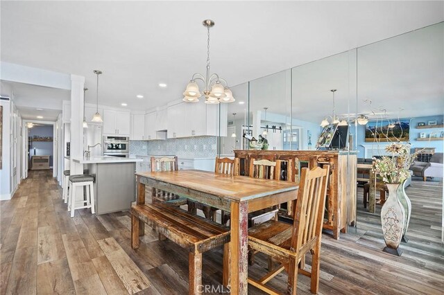22244 Treasure Island Dr Unit 5, Canyon Lake, CA 92587 - dining area with wood finished floors and a chandelier