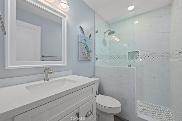 22244 Treasure Island Dr Unit 5, Canyon Lake, CA 92587 - bathroom featuring vanity, walk in shower, and toilet