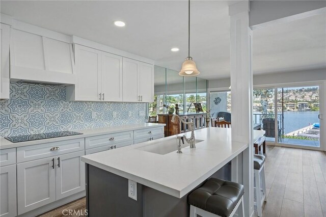 22244 Treasure Island Dr Unit 5, Canyon Lake, CA 92587 - kitchen with black electric cooktop, a sink, healthy amount of natural light, light countertops, and recessed lighting