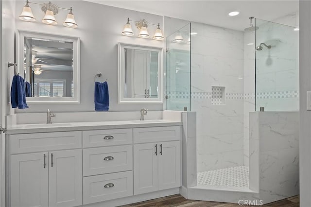 22244 Treasure Island Dr Unit 5, Canyon Lake, CA 92587 - bathroom featuring a marble finish shower, double vanity, wood finished floors, and ceiling fan