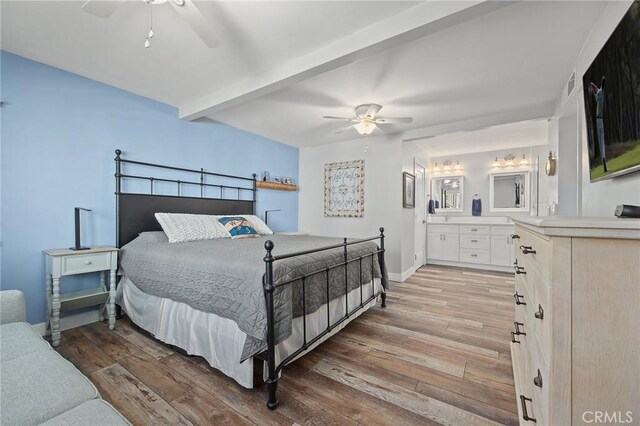 22244 Treasure Island Dr Unit 5, Canyon Lake, CA 92587 - bedroom featuring light wood finished floors, beamed ceiling, baseboards, connected bathroom, and ceiling fan